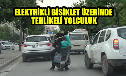 Elektrikli bisiklet üzerinde tehlikeli yolculuk