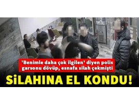 Garsonu döven polisin tabancasına el kondu